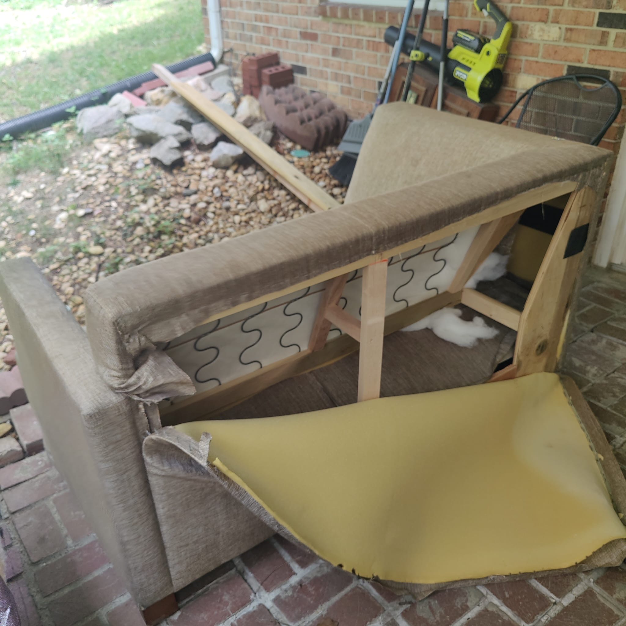 Damaged fabric couch before restoration