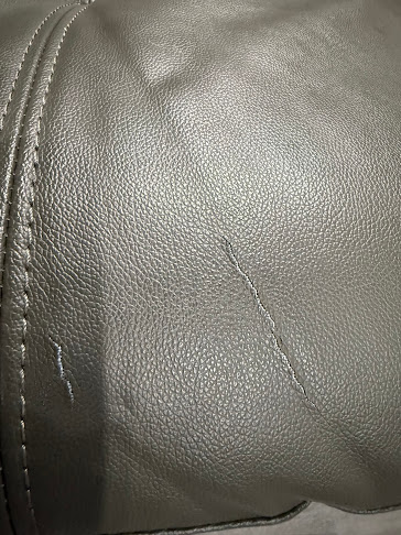 Damaged vinyl seat before restoration